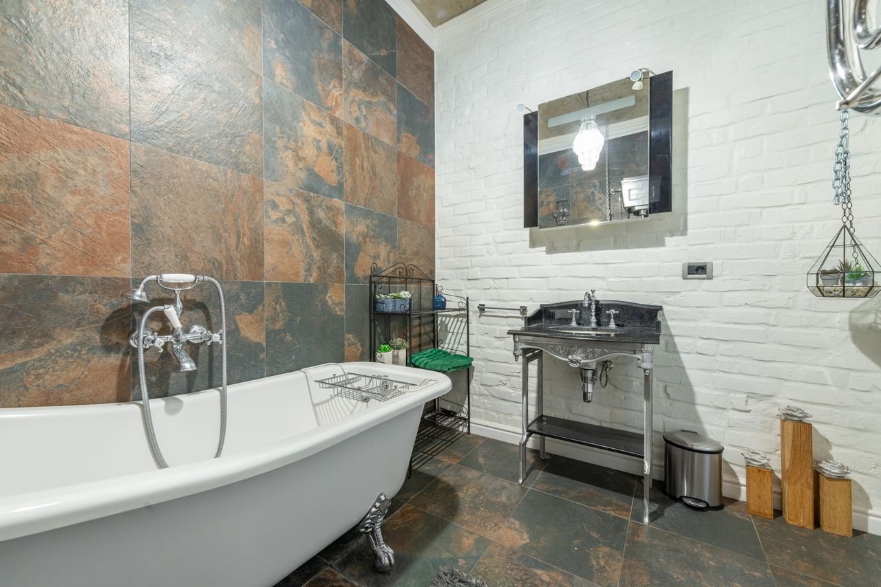 About Explore a beautifully styled bathroom featuring a clawfoot tub and modern design elements.